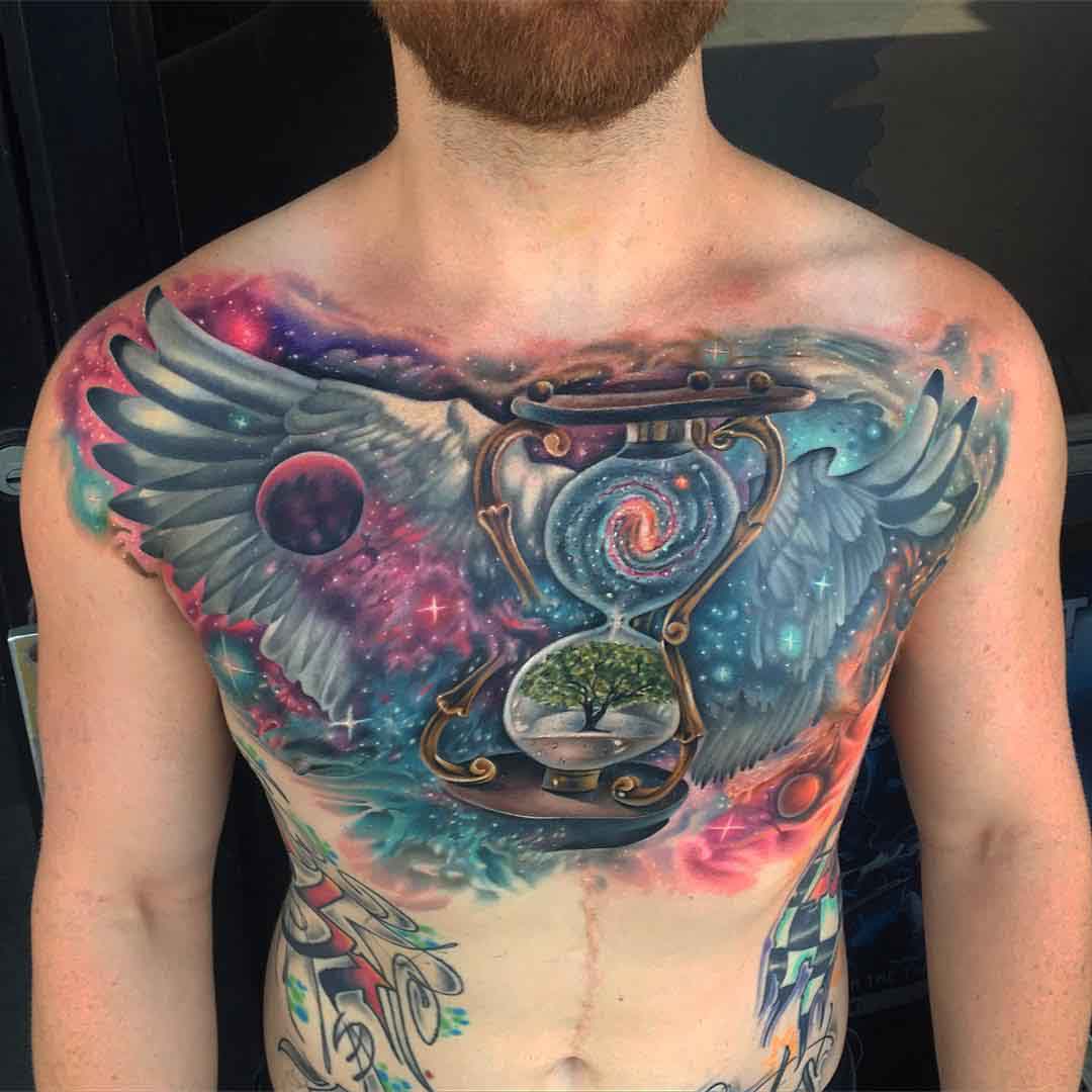 philosophical space themed chest tattoo