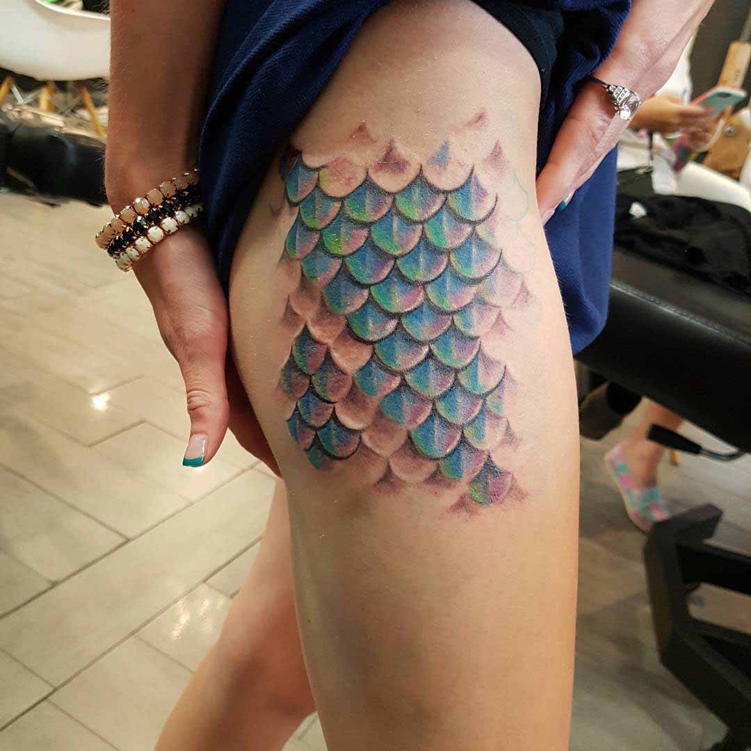fish scale pattern tattoo on hip