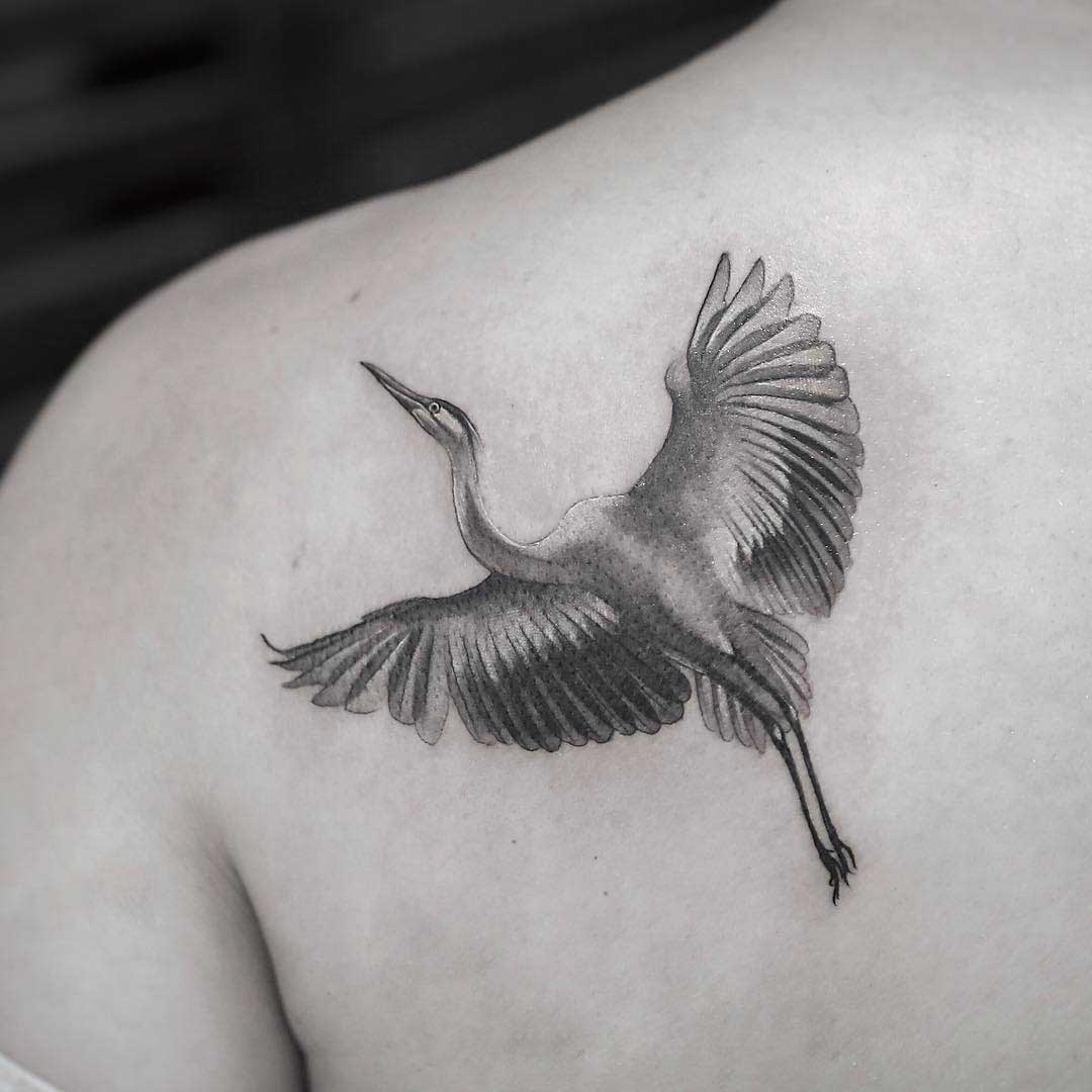 shoulder blade tattoo crane