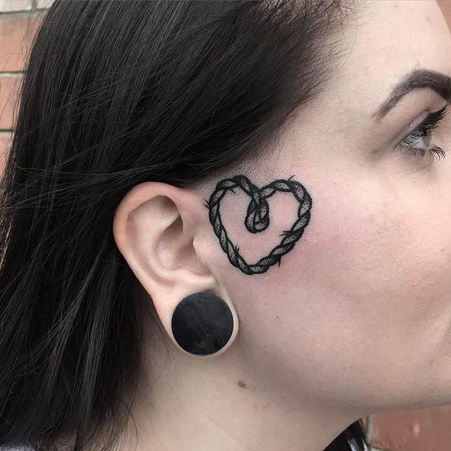 Girl With Tattoo on Face by Blakey Tattooer