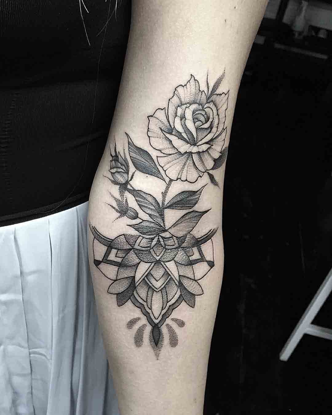 rose inner elbow tattoo