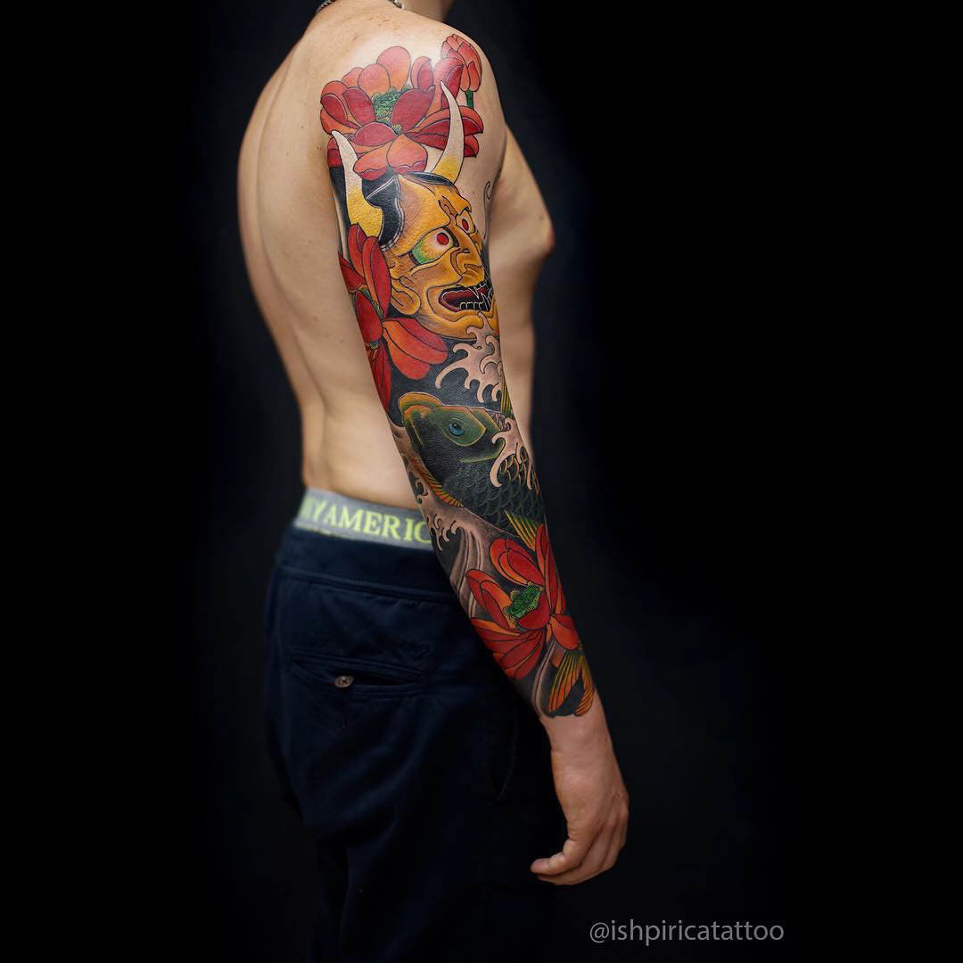 hannya mask and lotus flowers tattoo sleeve