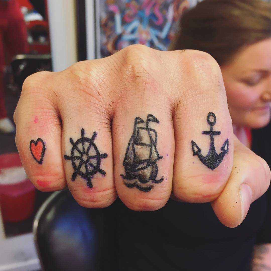 nautical themed tattoos on fingers
