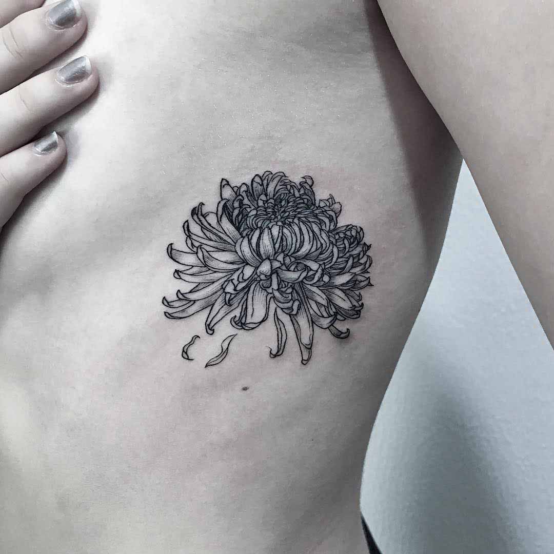 flower tattoo on ribs