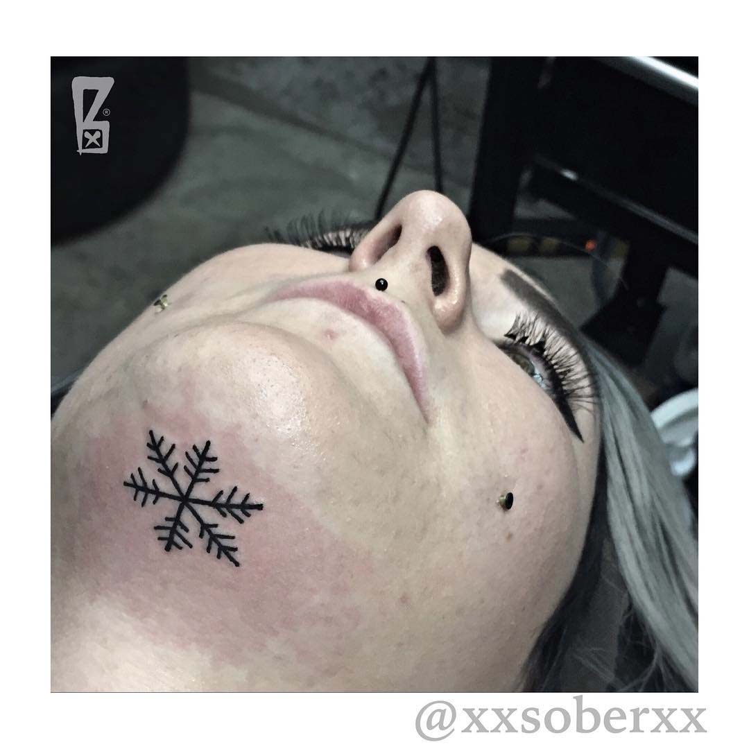 Simple Snowflake Chin Tattoo by xxsoberxx