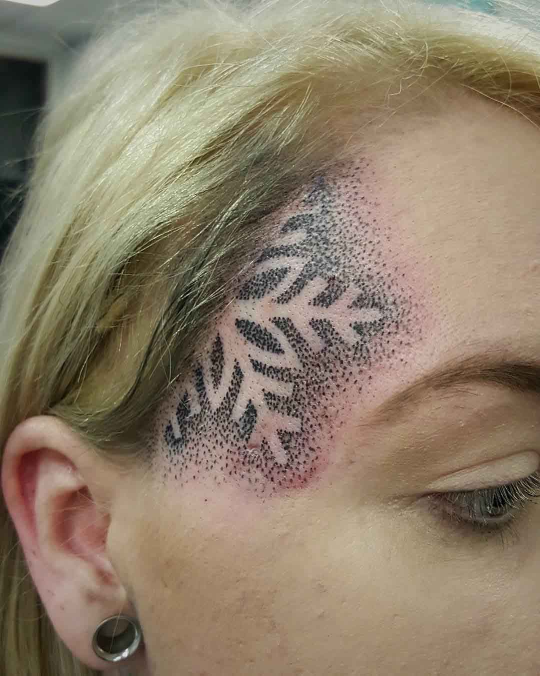 Snowflake Tattoo on The Face Side by Lynden Chadwick