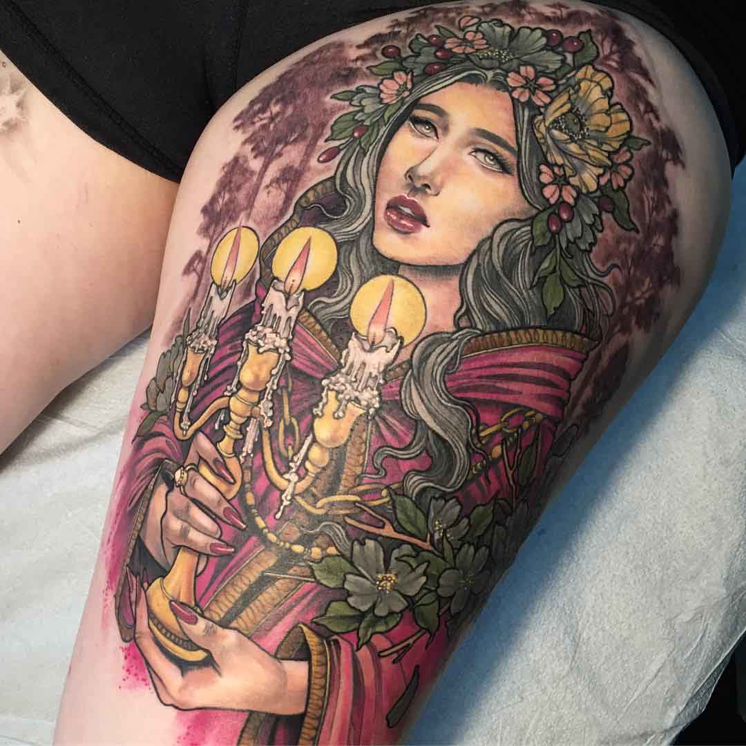 spring impersonation tattoo on thigh