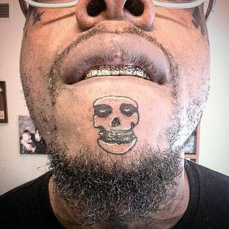 Weird Skull Tattoo on Chin by inksmith909