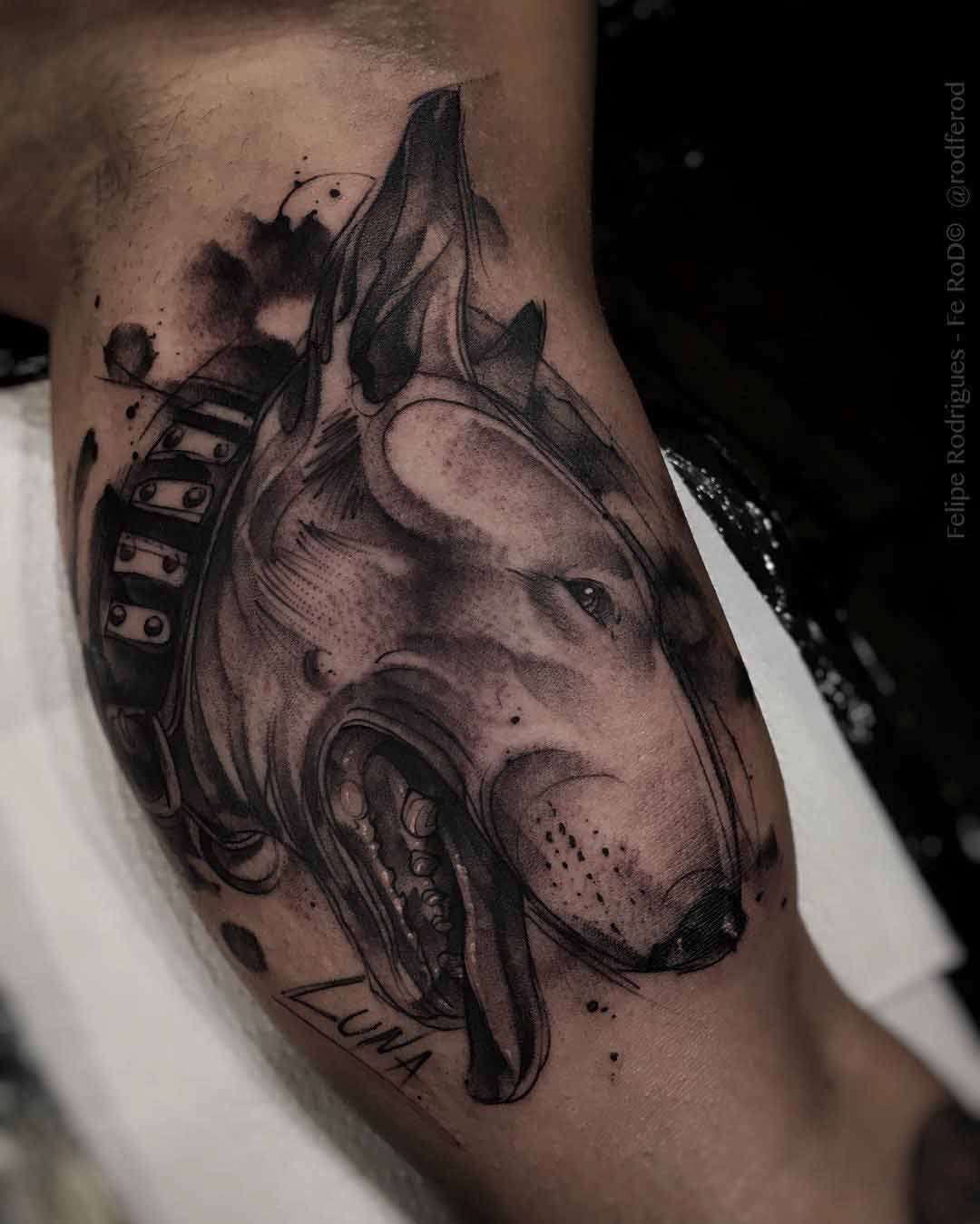 dog tattoo on bicep