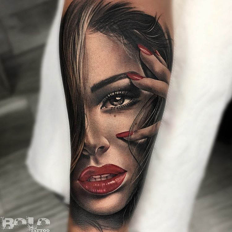 realistic portrait of a girl tattoo on forearm