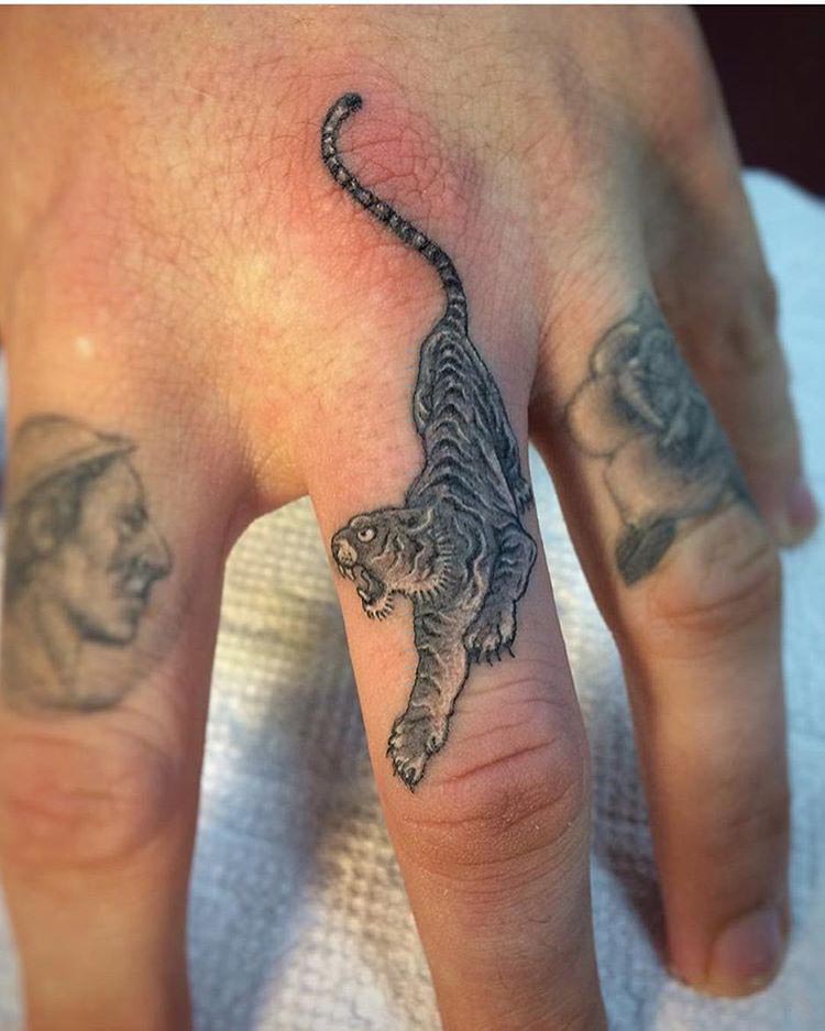 tiger tattoo on finger