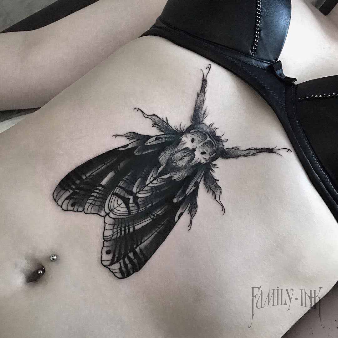 moth tattoo on stomach