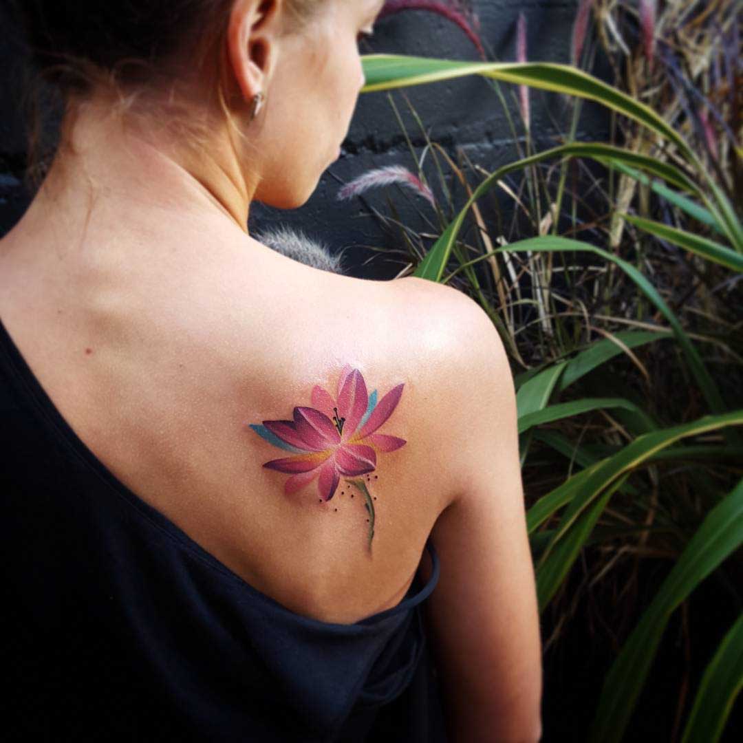 shoulder blade tattoo lotus girl