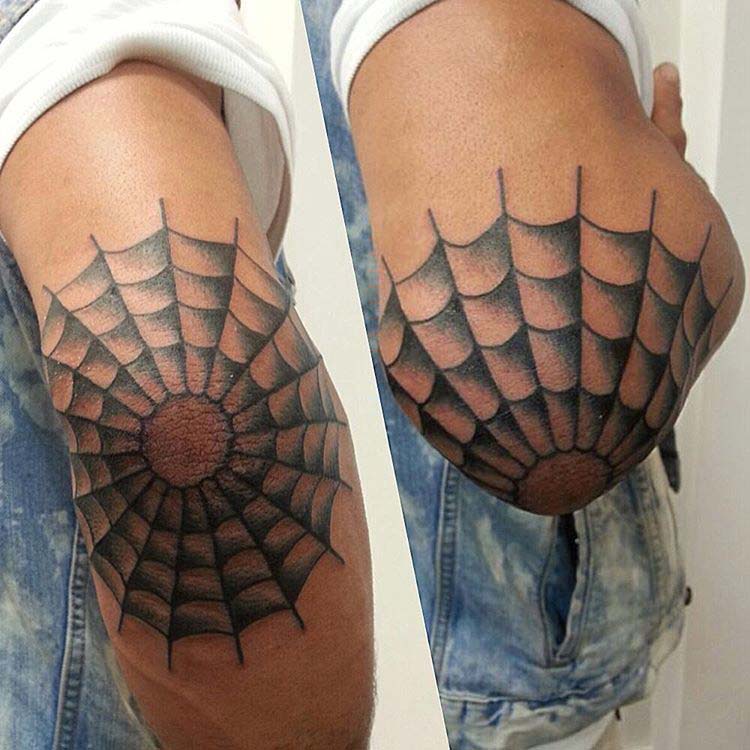 web tattoo on elbow