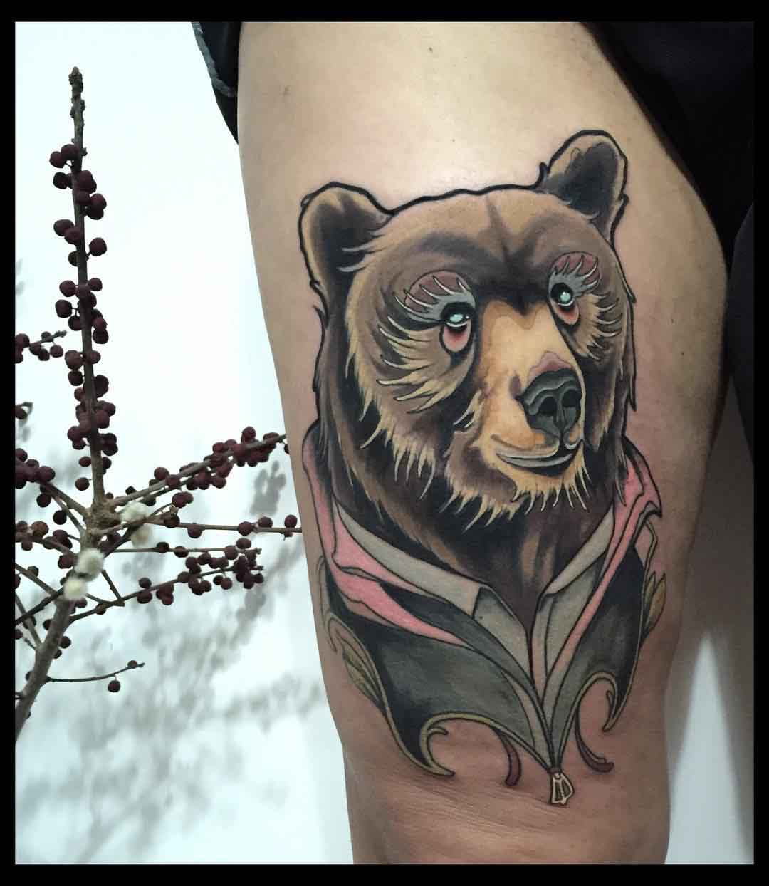 bear tattoo on thigh