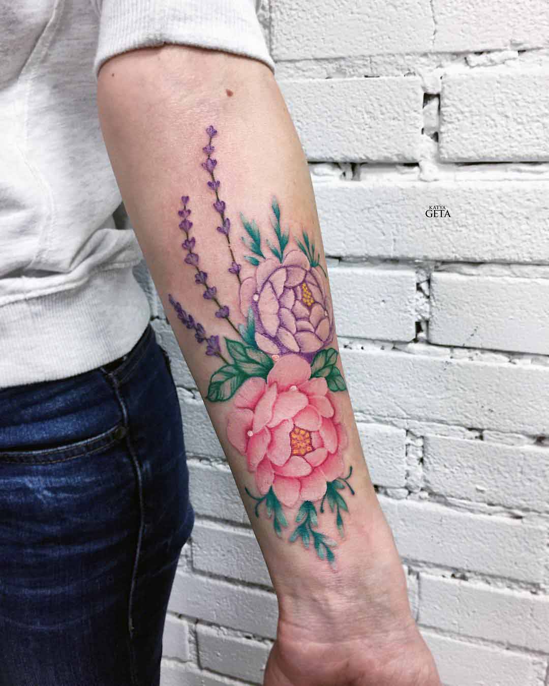 colorful flowers tattoo on forearm soft