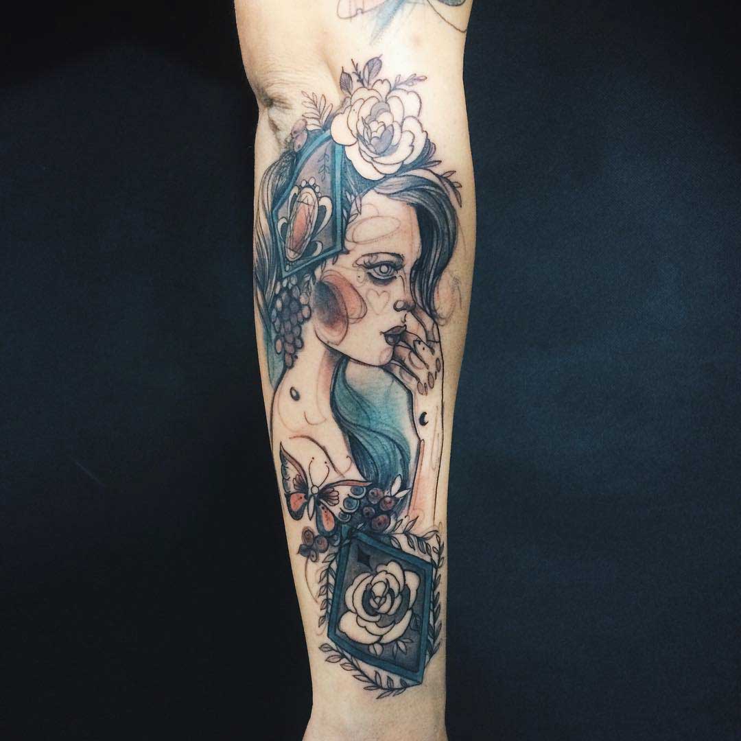 vintage style girl tattoo on forearm