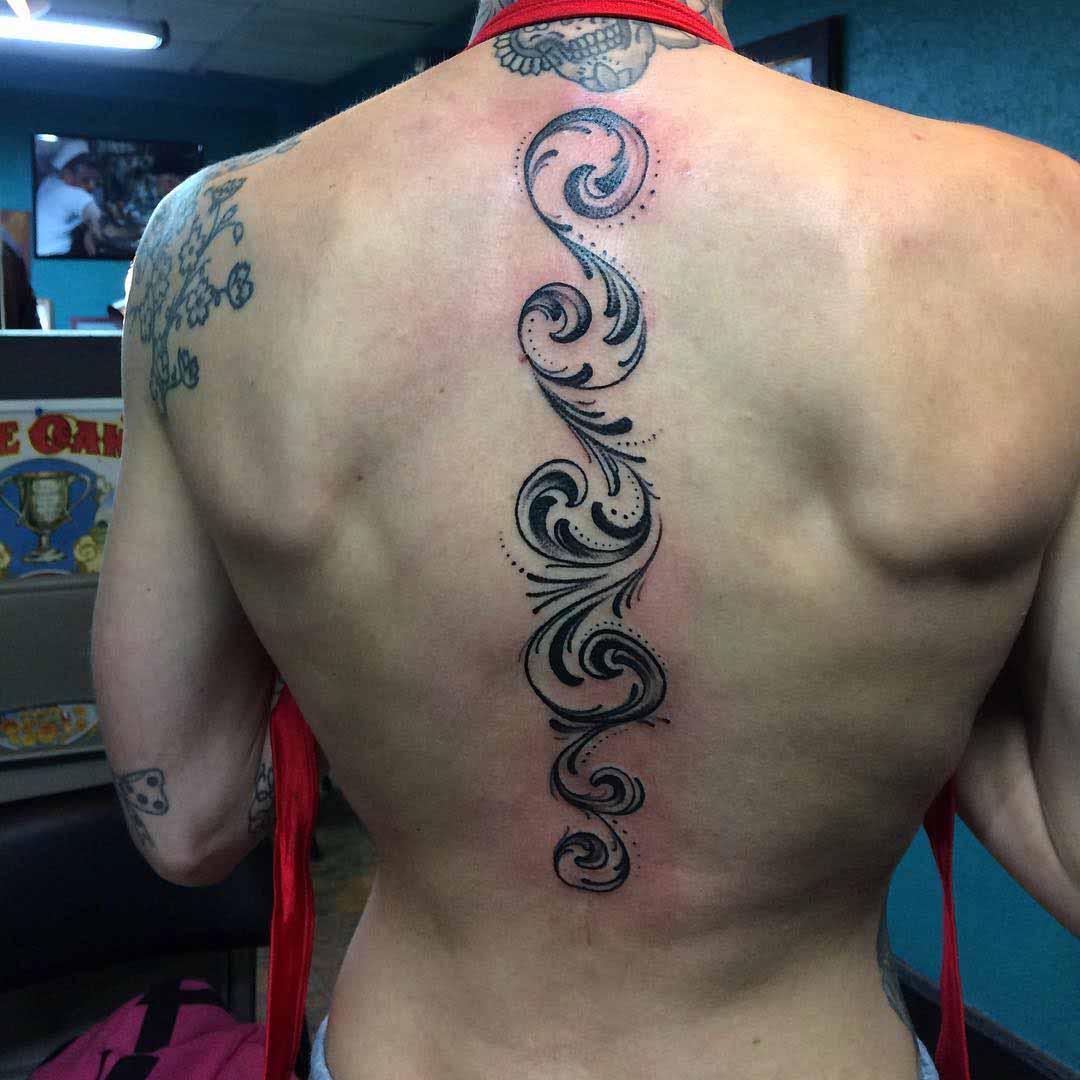 ornament tattoo on spine