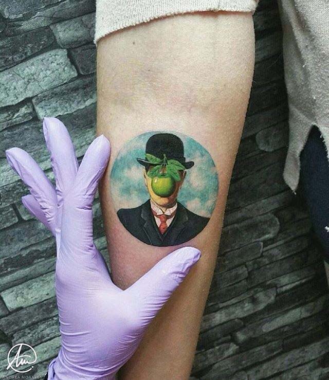 arm tattoo man and apple