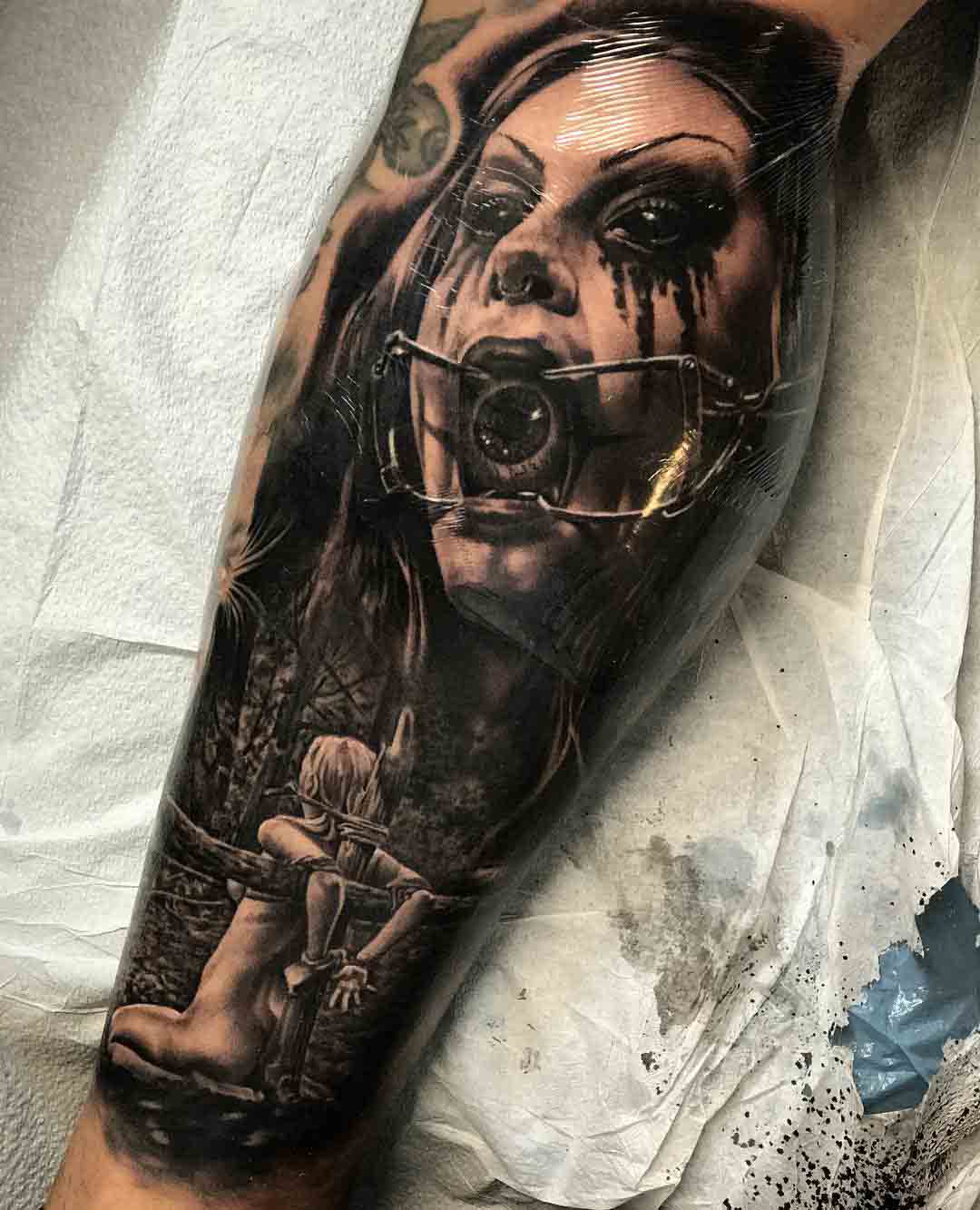 inner calf tattoo horror