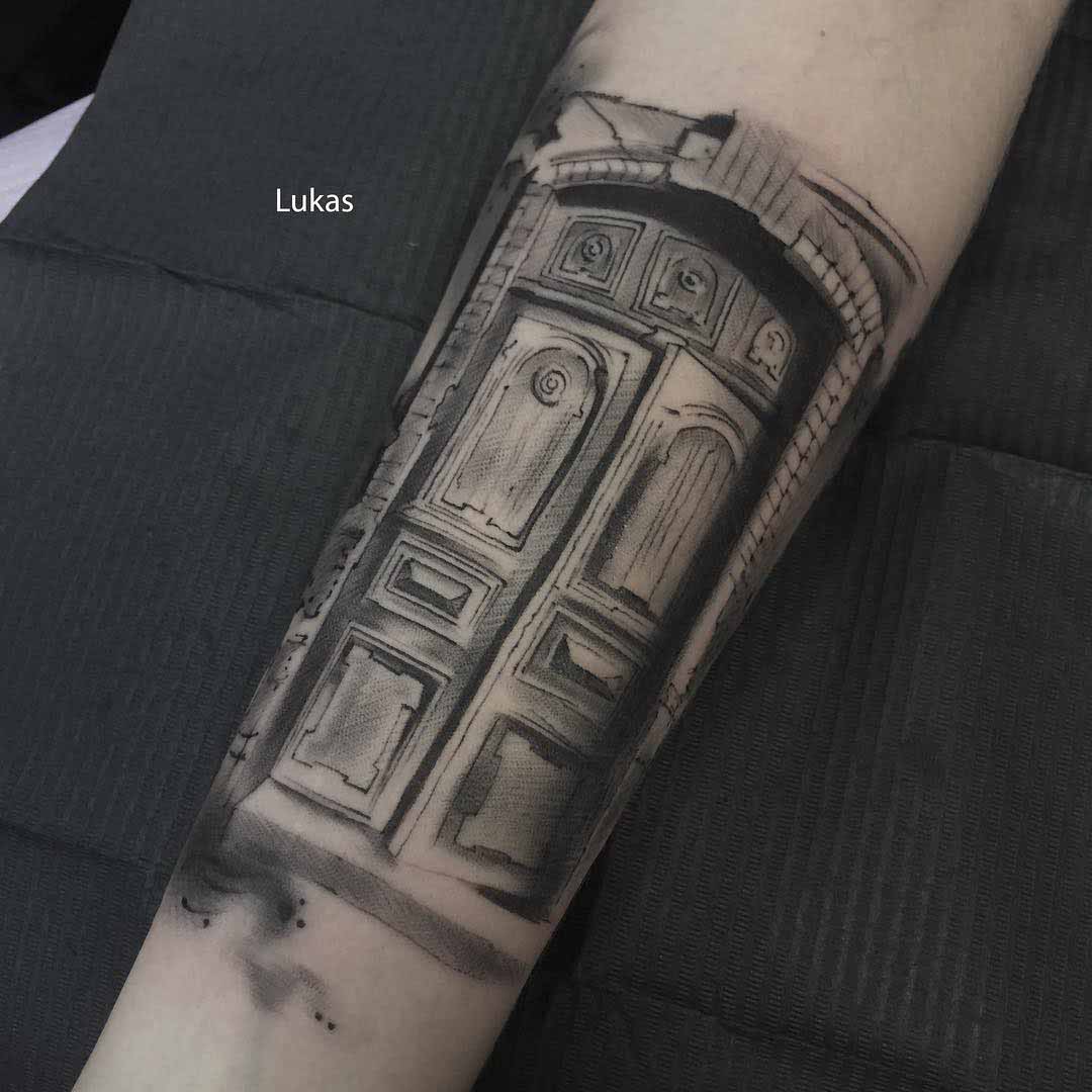 arm tattoo door gate black and grey