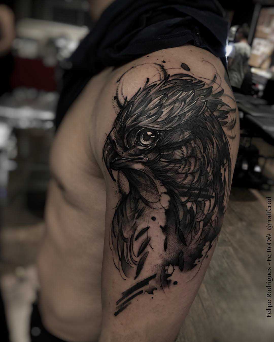 falcon tattoo on shoulder bird head