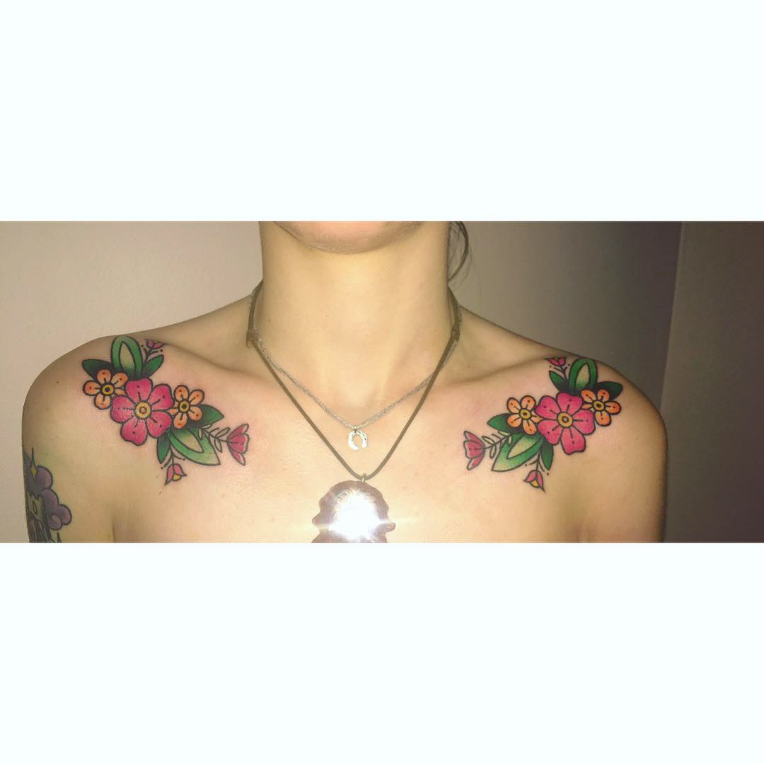 flowers tattoo on collar bones