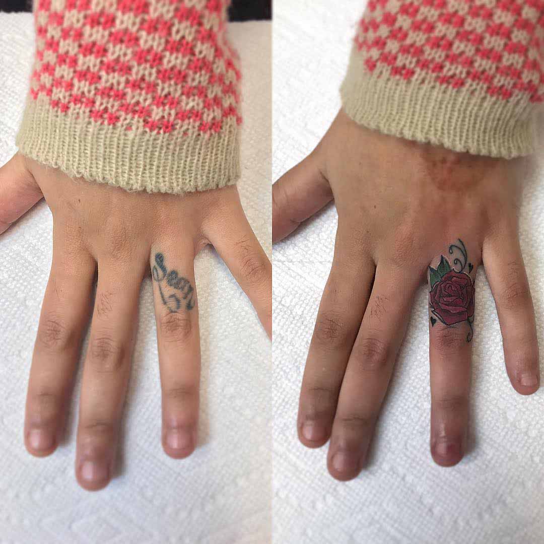 rose cover up tattoo on finger