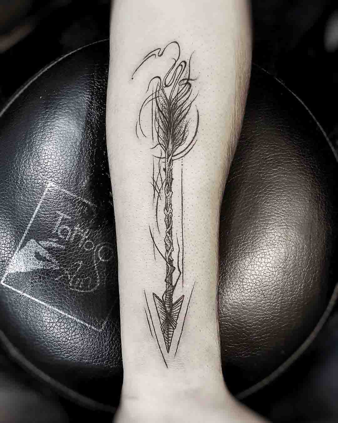 cool arrow tattoo on forearm