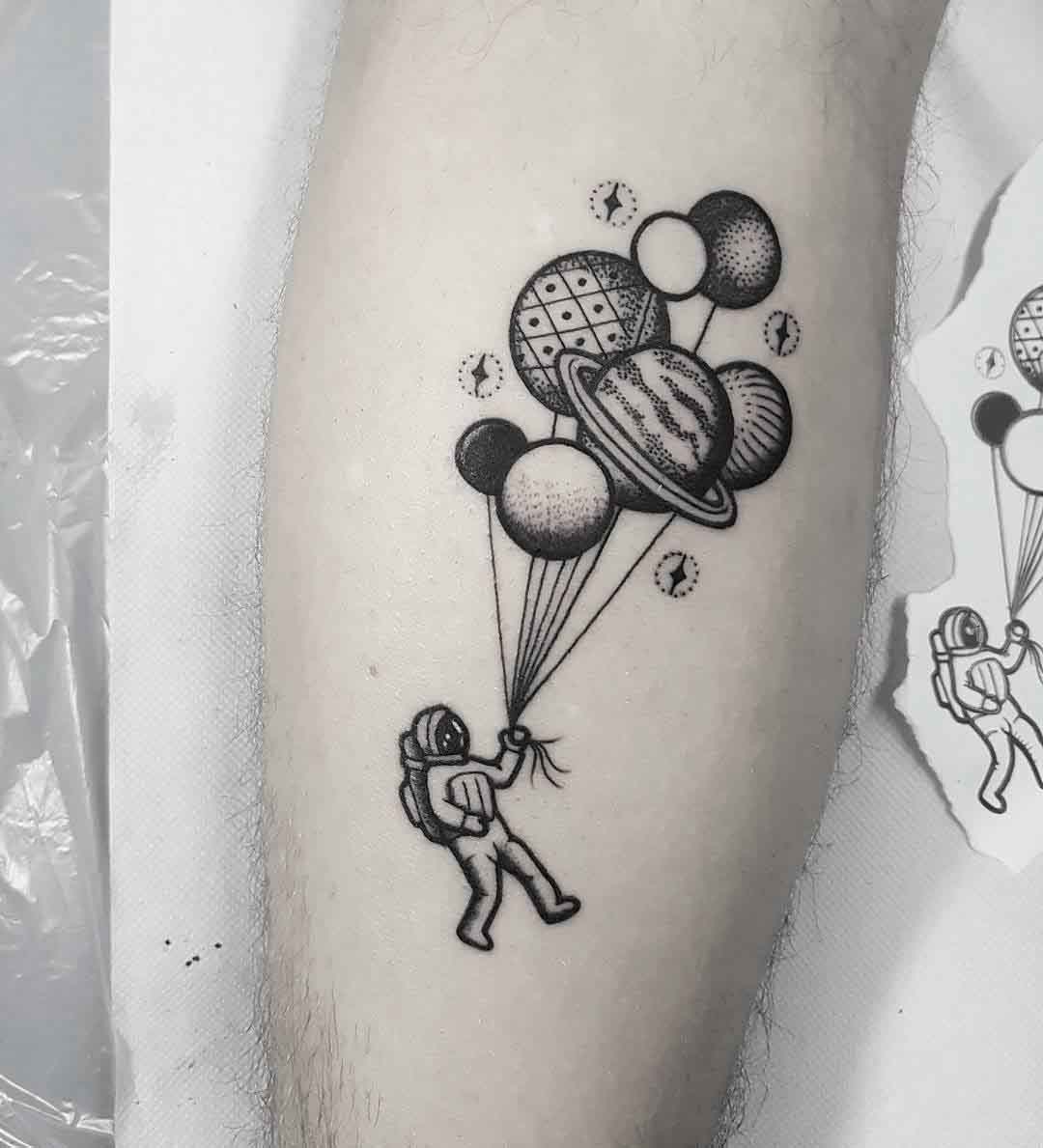 astronaut tattoo with balloons
