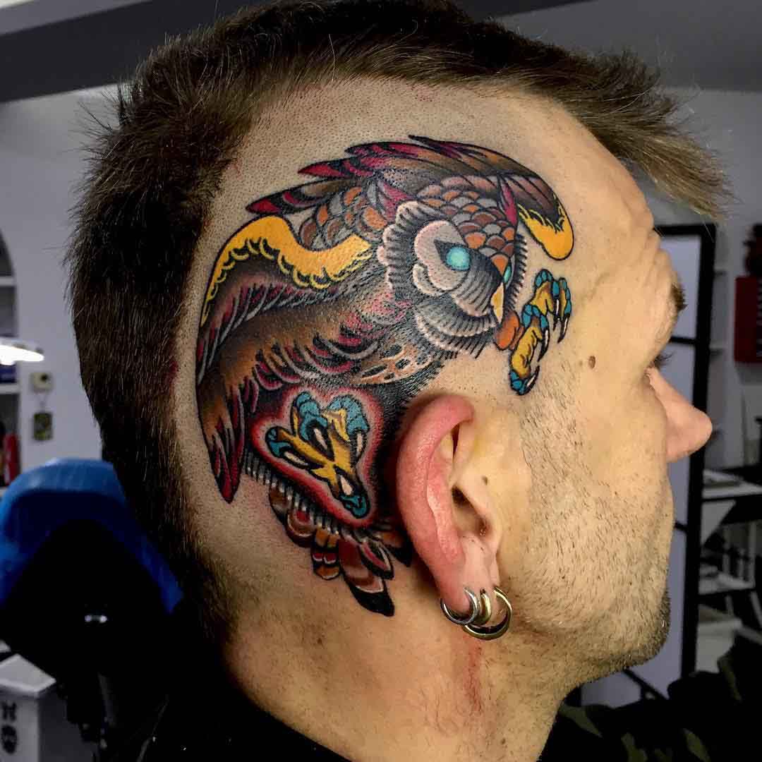 owl tattoo above euar on head side