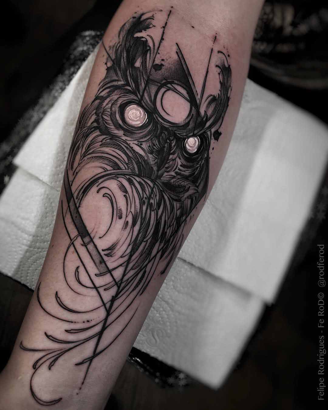 evil owl tattoo on arm