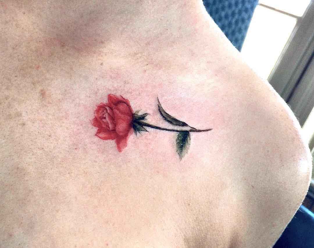 small rose tattoo on collar bone