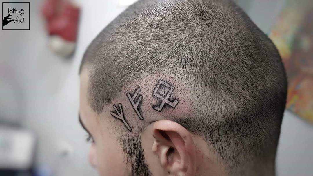 head tattoo with runes