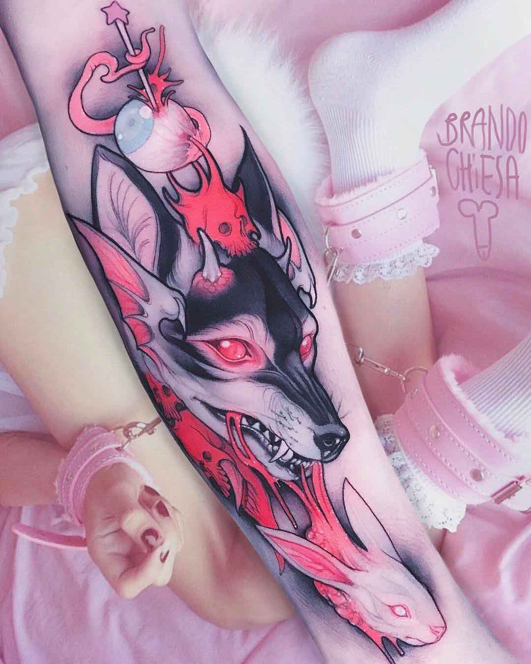 pink predator tattoo on arm