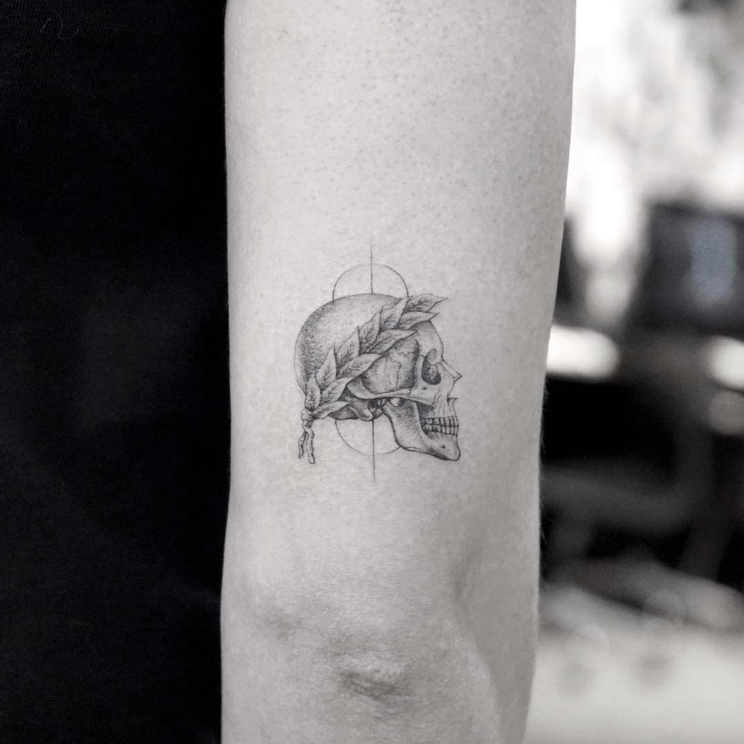 small skull roman tattoo