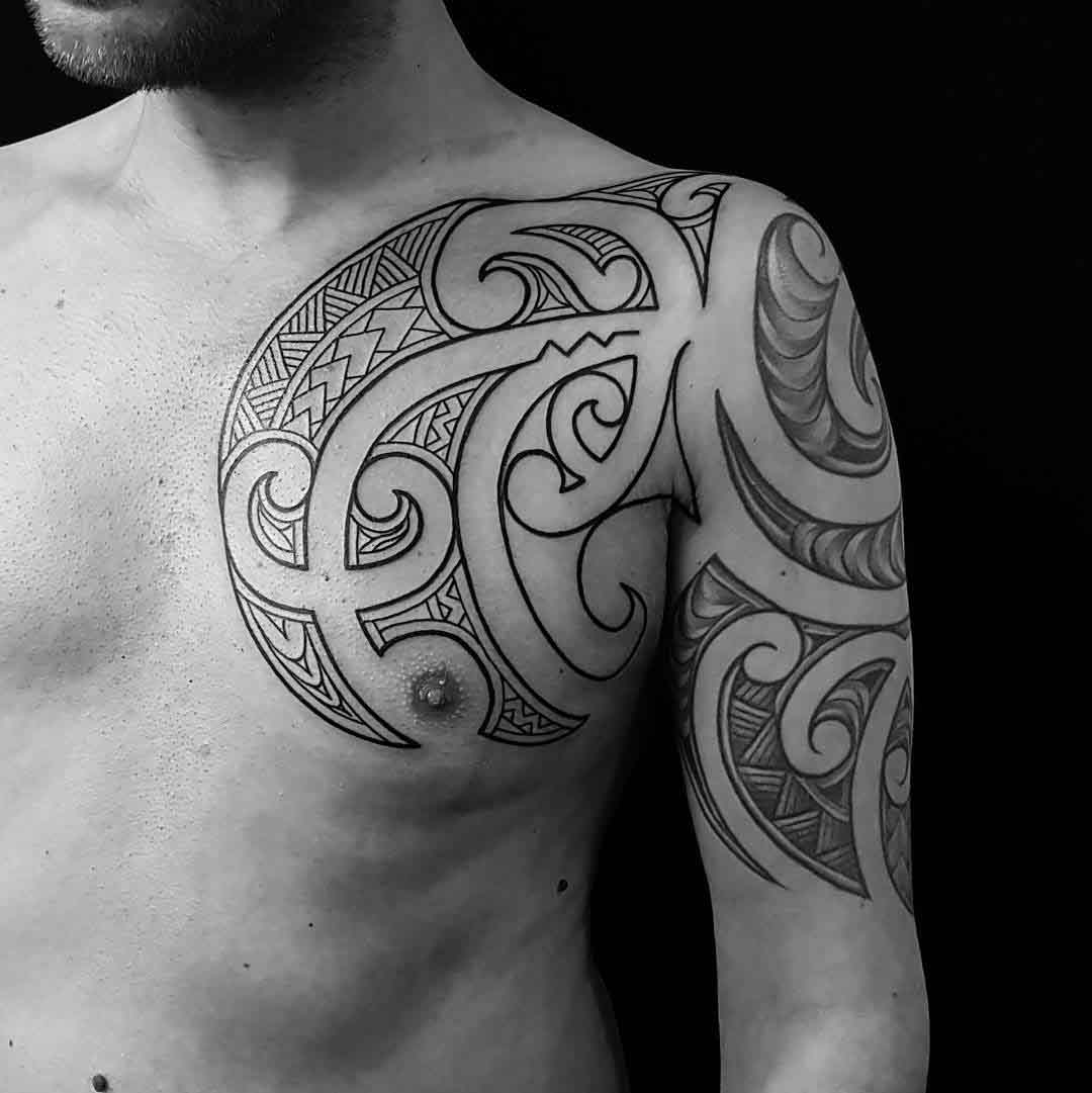 tribal tattoo on shoulder and chest