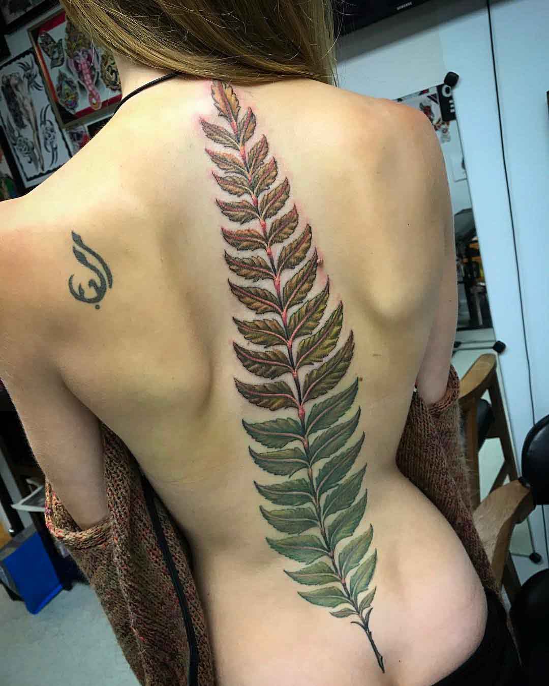 spine tattoo fern leaf big