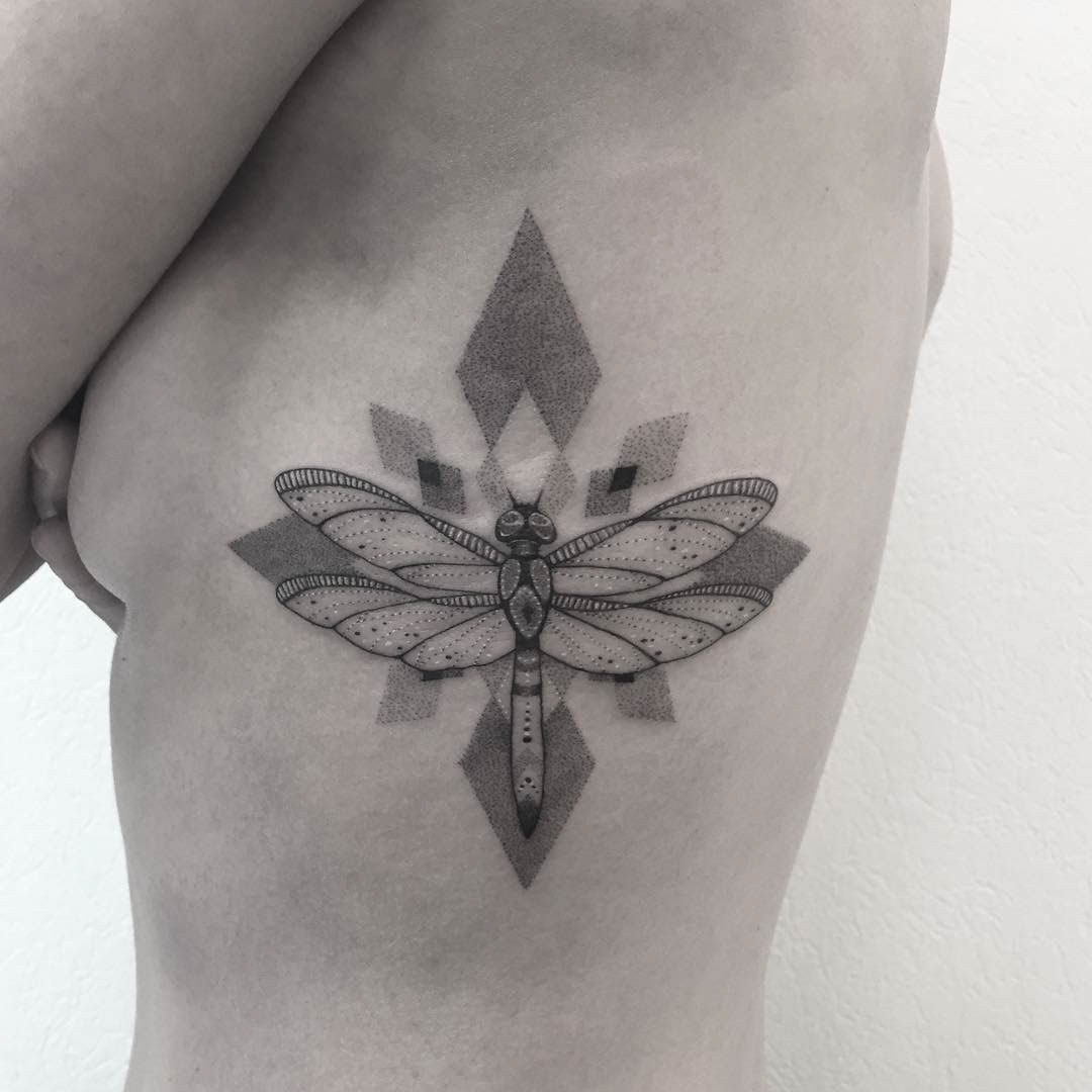 rib tattoo dragonfly