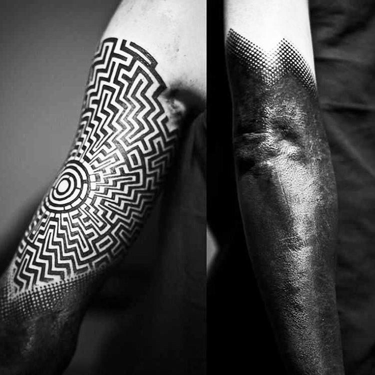 geometrical tattoo labyrinth on arm