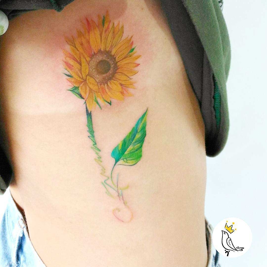 sunflower tattoo on torso side