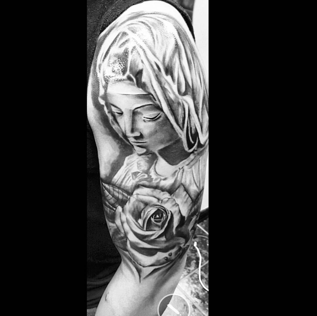 shoulder tattoo of Virgin Mary