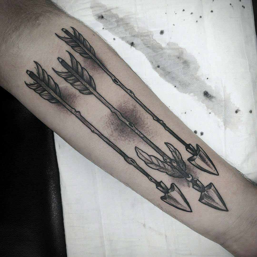 three arrows tattoo on arm