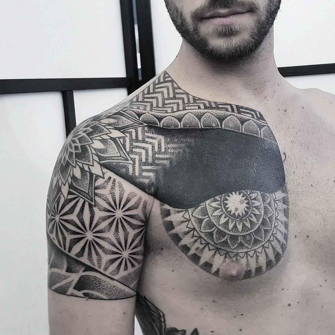 dotwork chest tattoo to shoulder