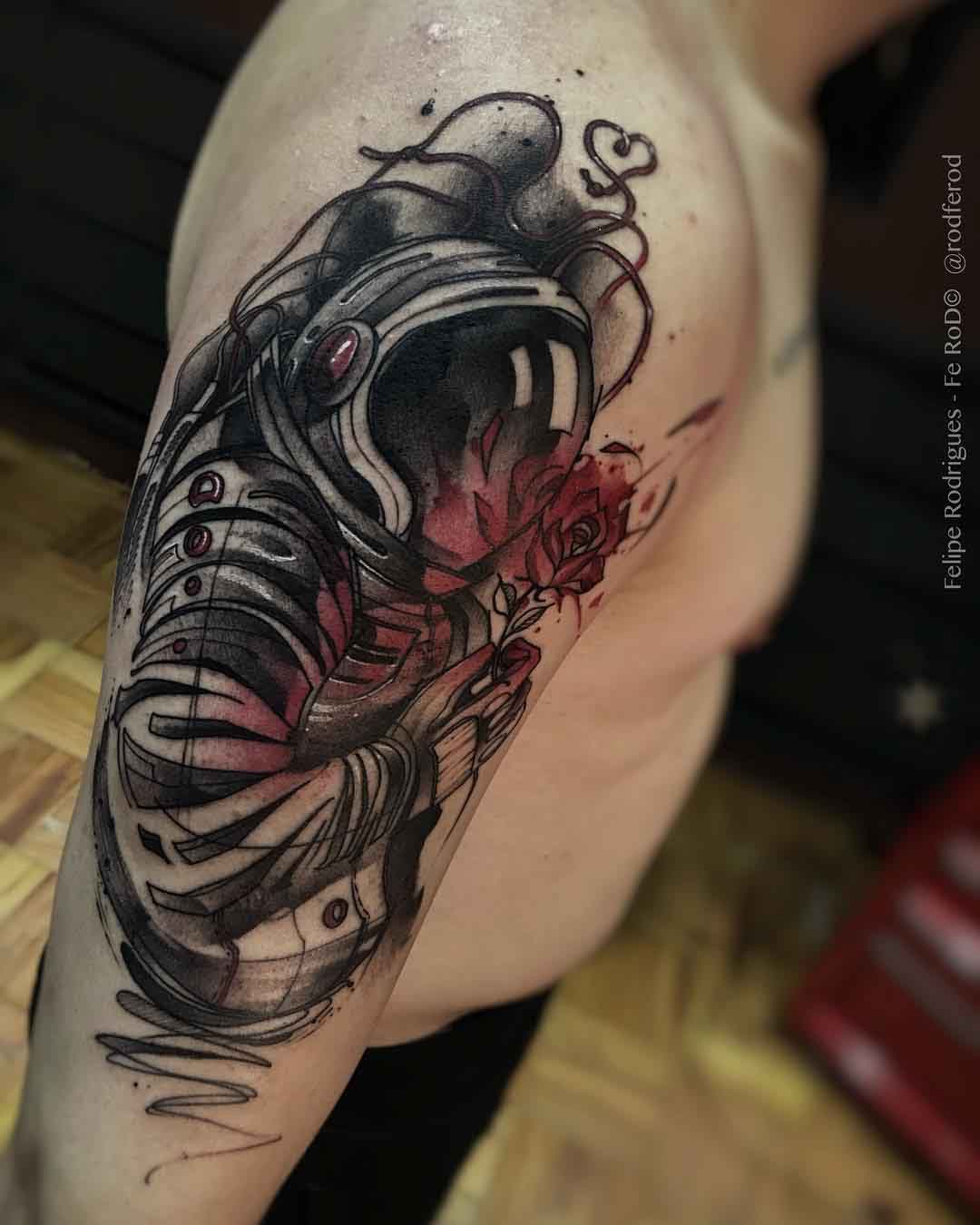 shoulder astronaut tattoo with red rose