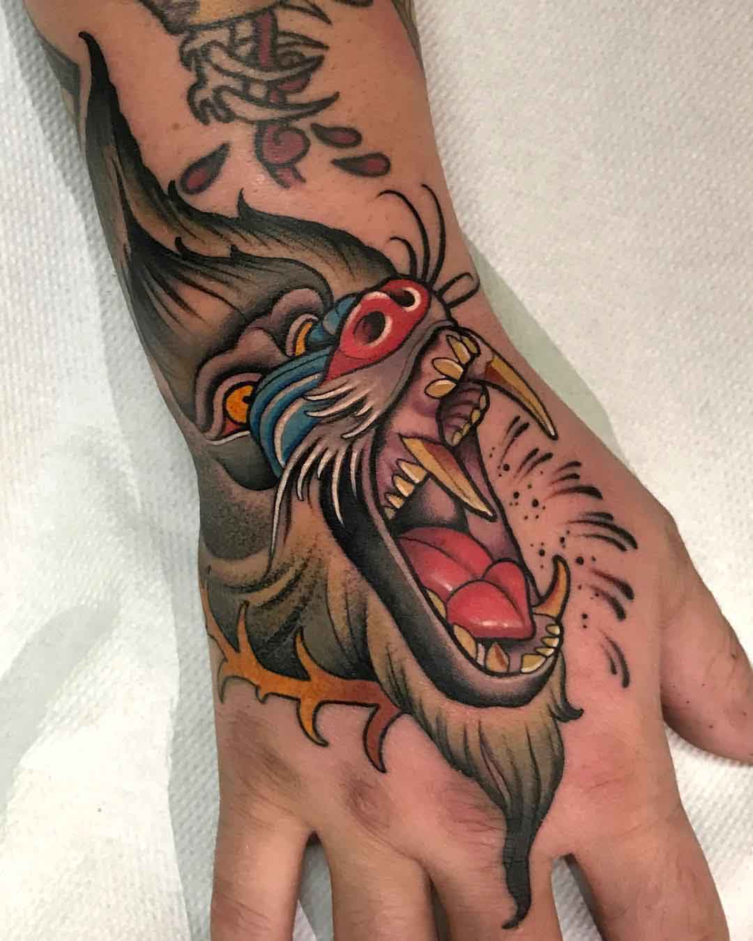 hand tattoo baboon neo-traditional style