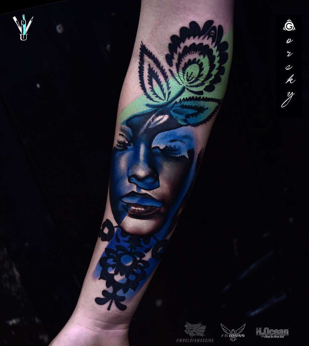 arm tattoo abstract portrait with flower