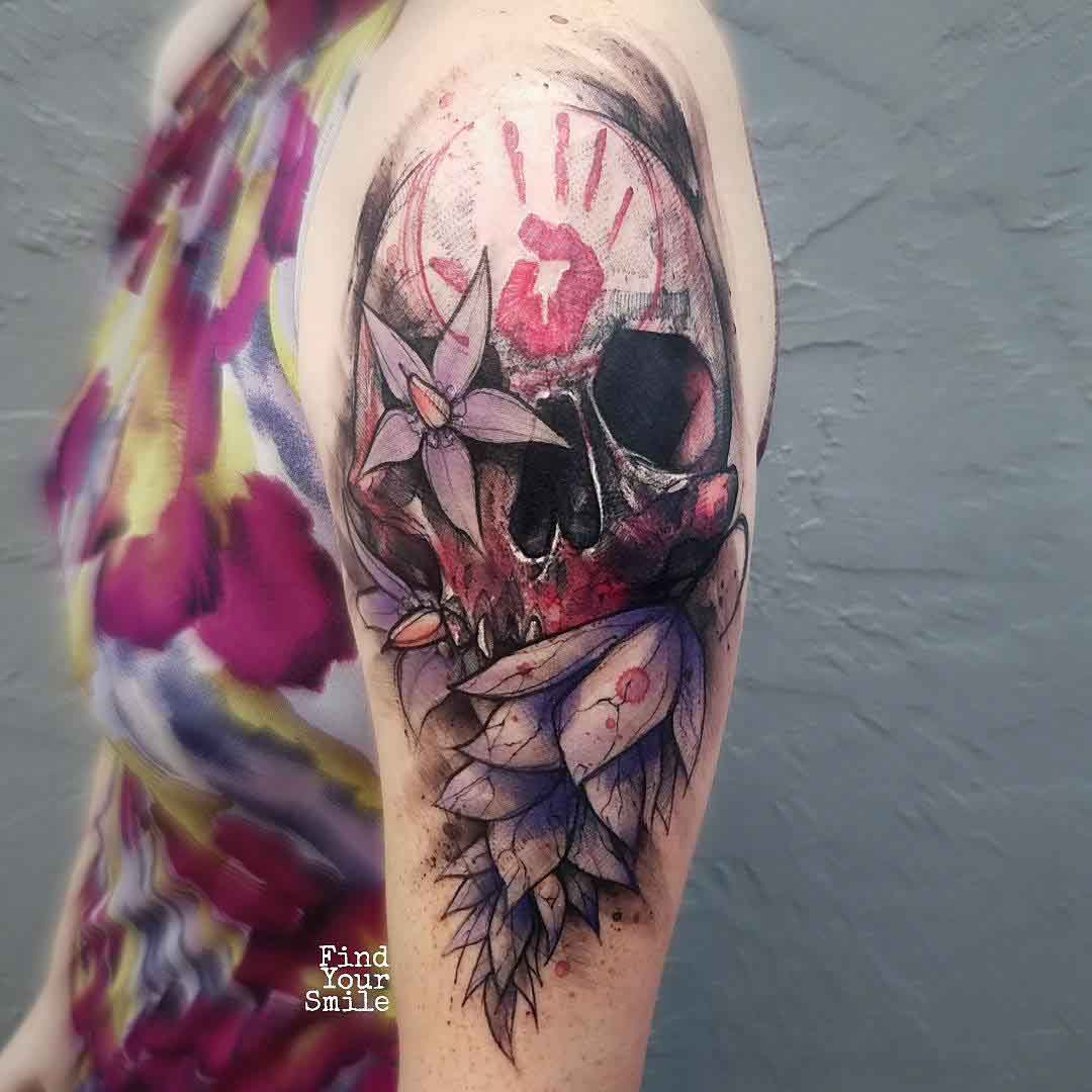 colorful skull tattoo on shoulder
