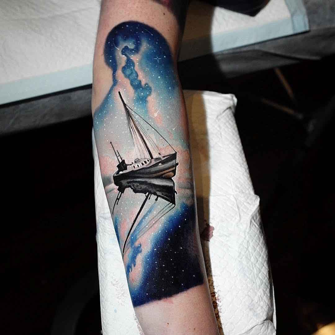 arm ship tattoo night sky