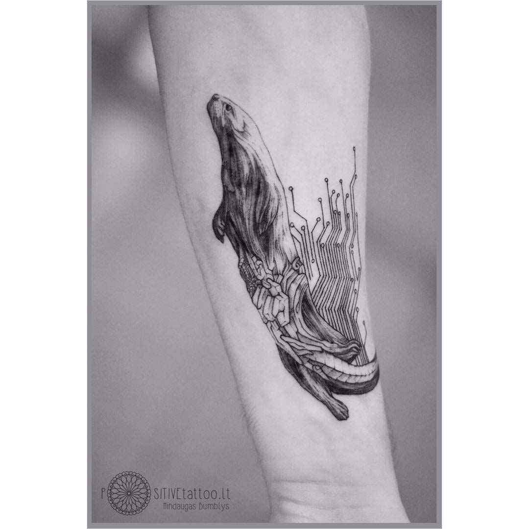 Arm tattoo otter